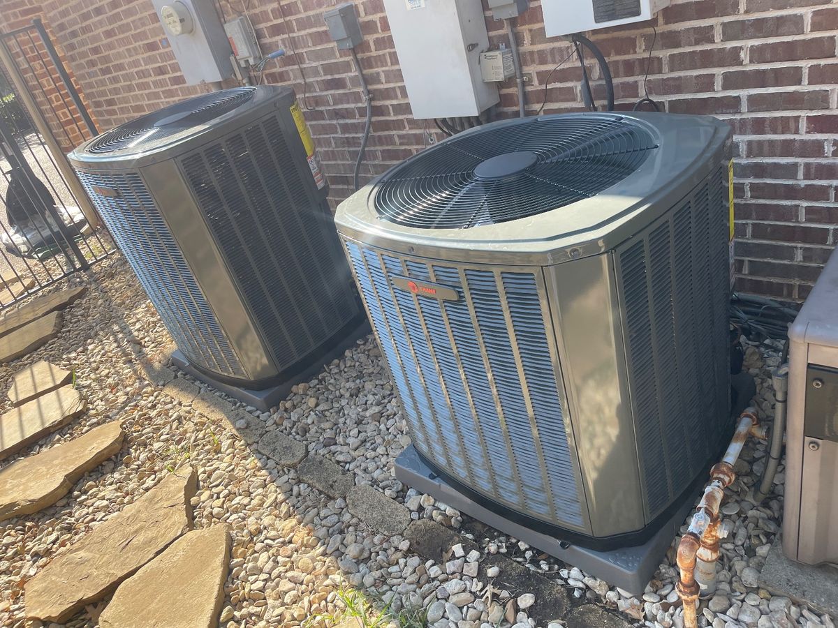 University Park HVAC — pair of new outdoor AC condensers on pads
